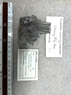 Fluorite xls. On Stibnite xls.