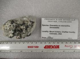 Phenakite on microcline with zinnwaldite