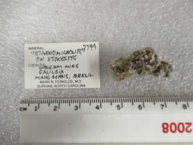 Oxystannomicrolite with Stokesite