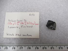 Scharlomite