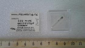 Melanostibite