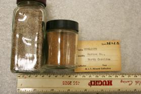 Monazite-(Ce) sand in class jar