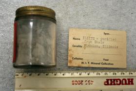 Illite powder in glass jar, purified from Shale