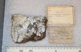 Cordierite var. Fahlunite (being replaced by mica)