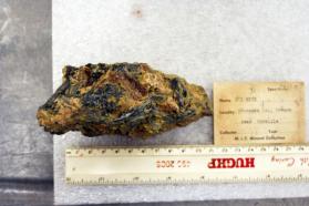 Stibnite crystals in matrix with yellow alteration?