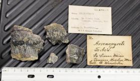 Arsenopyrite veins in matrix with Quartz, Copper sulifide? As well as yellow and blue alteration coatings?